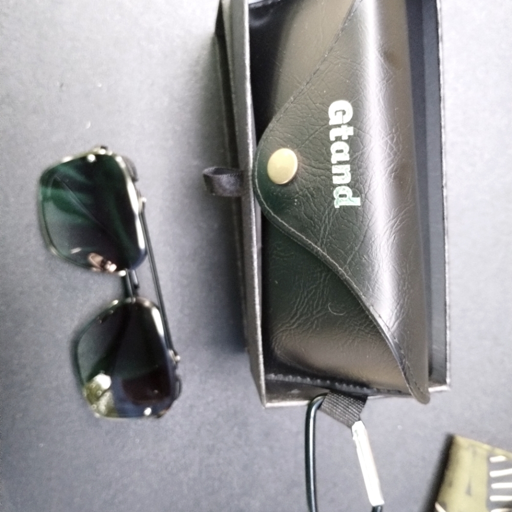 Men's all black sunglasses comes with case and extra nose pads.